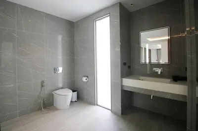 a bathroom with a toilet and a sink and a mirror at Modern Private Pool Villa - Peaceful Kamala Stay in Kamala Beach