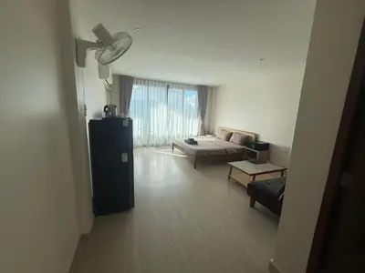 a living room with a couch and a table at RK Boutique rooms in Patong Beach