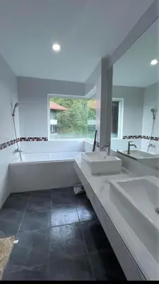 a large bathroom with two sinks and a tub at Phuket 604 in Phuket Town