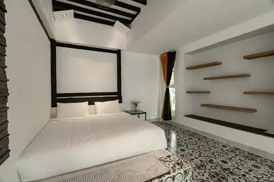 a bedroom with a white bed and a large window at The Garden Escape Villa, Private Tropical Hideaway in Rawai Beach