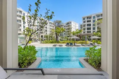 a view of a swimming pool at a resort at Porto 1BR Pool Access Suite at Title Legendary in Bang Tao Beach