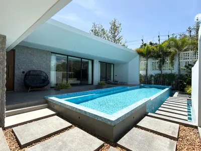 a swimming pool in the backyard of a house at Clover Residence Villa Phuket in Koh Lone