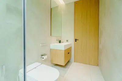 a bathroom with a toilet and a sink and a mirror at Brand New Asherah Pool Villa next to Bangtao Beach VVPHU52 in Ban Riang