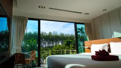 a bedroom with a bed and a large window at BangTao 3 Bedrooms Bali Tropical Pool Villa Quiet Private Space Guest Preferred in Bang Tao Beach