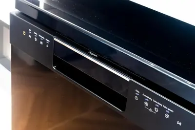 a black microwave oven sitting on top of a table at KORA 2BR LUXURY POOL VIEW Apartment in Layan Beach