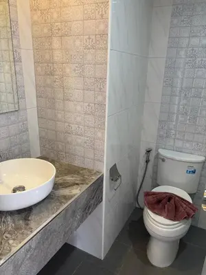 a bathroom with a toilet and a sink at Apartment in Patong Beach in Patong Beach