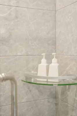 a bathroom with a shelf with two toothbrushes at B201 Banjong Studio 3 Minutes To Nai Harn Beach in Rawai Beach
