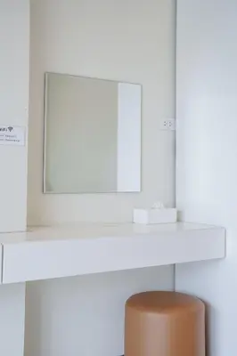 a white desk with a mirror and a brown stool at B201 Banjong Studio 3 Minutes To Nai Harn Beach in Rawai Beach