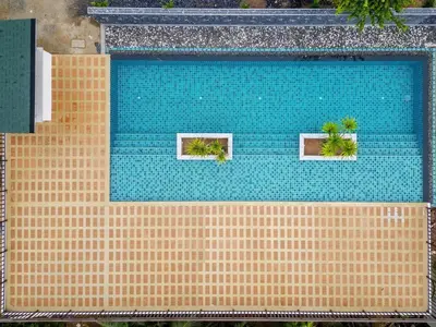 an overhead view of a swimming pool with two windows at B203 Banjong Studio 3 Minutes To Nai Harn Beach in Rawai Beach