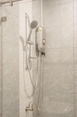a shower with a shower head in a bathroom at B203 Banjong Studio 3 Minutes To Nai Harn Beach in Rawai Beach