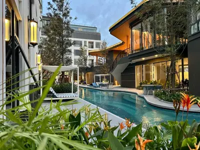 a swimming pool in the middle of a building at Bellevue Lagoon Phuket in Laguna Phuket