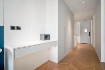 a hallway with white walls and a microwave on a counter at Premier Kora 3-Bedroom Apartment E333 Beachfront in Phuket Town
