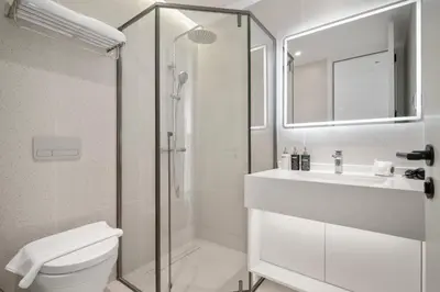 a bathroom with a toilet and a sink and a shower at Premier Kora 3-Bedroom Apartment E333 Beachfront in Phuket Town