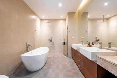 a bathroom with two sinks and a large tub at Tropic Escape @ Baan Wana Phuket in Thalang