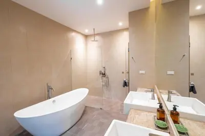 a bathroom with a tub and a sink and a shower at Tropic Escape @ Baan Wana Phuket in Thalang