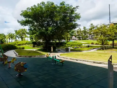 a park with a playground with toy animals on the ground at Двухкомнатные апартаменты Laguna Skypark in Laguna Phuket