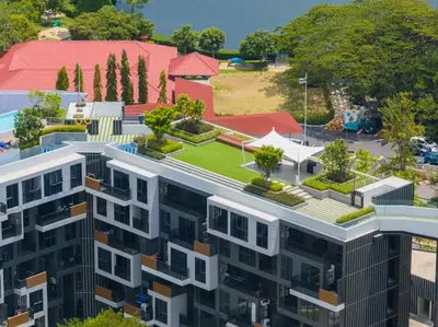 a building with a green yard on top of it at Двухкомнатные апартаменты Laguna Skypark in Laguna Phuket