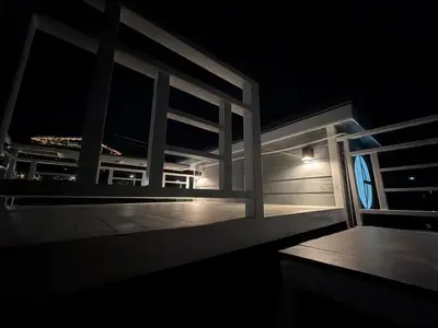 a view of a balcony at night with a window at Siriwan boutique hotel in Ban Met Nang Chi