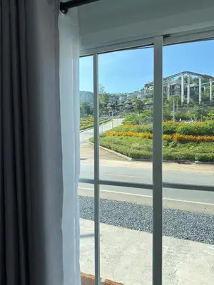 an open window with a view of a street at Siriwan boutique hotel in Ban Met Nang Chi