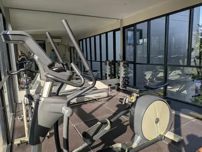a gym with a view of the city at 2BR Apt 2510 Gem Resort near Bangtao Beach in Bang Tao Beach