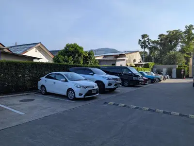 a row of cars parked in a parking lot at 2BR Apt 2510 Gem Resort near Bangtao Beach in Bang Tao Beach