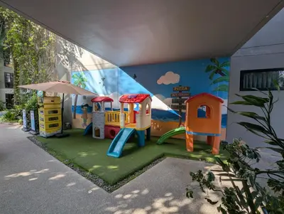 a childrens play area with a mural of a playground at 2BR Apt 2510 Gem Resort near Bangtao Beach in Bang Tao Beach