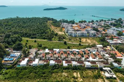an aerial view of a resort with the ocean at Tropical Rawai Beach Home Retreat with Pool & Gym in Rawai Beach