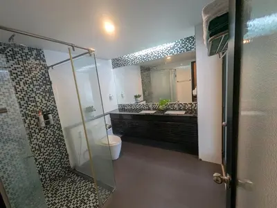 a bathroom with a shower and a toilet and a sink at Large 1 Bed Condo in Kamala Regent, Close to Beach in Kamala Beach