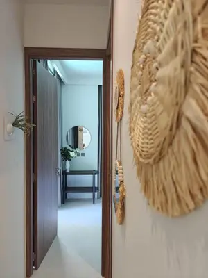 a hallway with a door with a shell on the wall at Aileen Layan Villa 3 Private Pool 4 Bedroom in Phuket Town