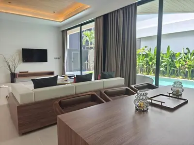 a living room with a couch and a table at Aileen Layan Villa 3 Private Pool 4 Bedroom in Phuket Town