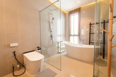a bathroom with a tub and a toilet and a shower at Luxury Teak 4BR Private Pool Villa in Bang Tao in Laguna Phuket