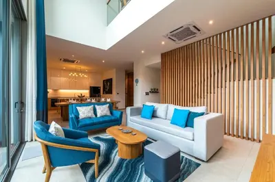 a living room with a couch and chairs and a table at Luxury Teak 4BR Private Pool Villa in Bang Tao in Laguna Phuket