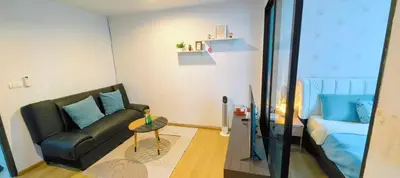 a living room with a couch and a table at cen807 in Phuket Town