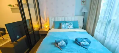a bedroom with two hearts on a blue bed at cen807 in Phuket Town