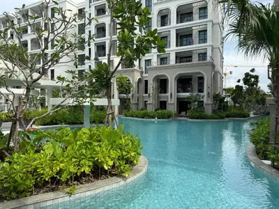 a swimming pool in front of a building at Apartment at the brand new Title Legendary by Lofty in Bang Tao Beach