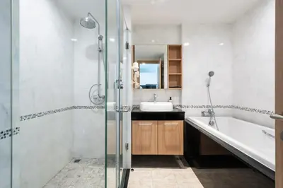 a bathroom with a tub and a sink and a shower at Modern Studio @ Kata Beach in Ban Karon