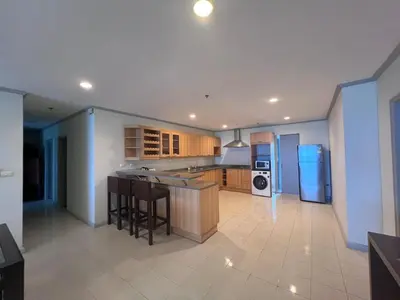 a kitchen with a refrigerator and a counter top at Patong Beachfront Tower 30 Floor Penthouse in Patong Beach