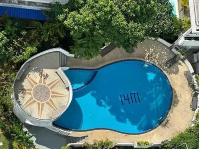 an overhead view of a large swimming pool with at Patong Beachfront Tower 30 Floor Penthouse in Patong Beach