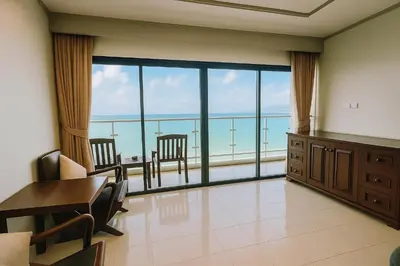 a room with a view of the ocean at Patong Beachfront Tower 30 Floor Penthouse in Patong Beach