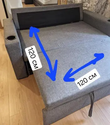 a gray couch with two signs on the floor at Comfortable Relax at Rawai Title in Ban Saiyuan (1)
