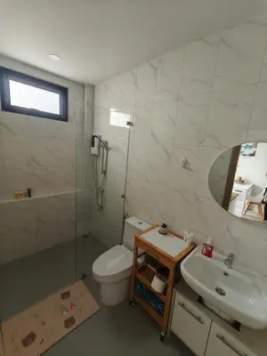 a bathroom with a toilet and a sink and a shower at PS Guesthouse in Kathu