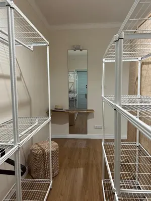 a room with three bunk beds and a mirror at Roomy renovated Apartments in Phuket in Ban Sam Kong