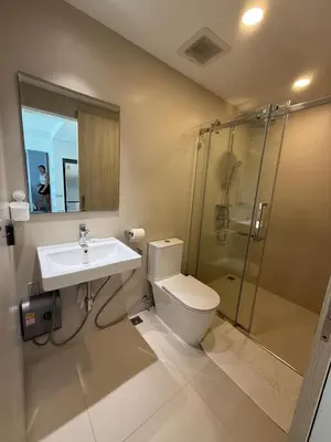 a bathroom with a toilet and a sink and a shower at Laguna SkyPark in Laguna Phuket