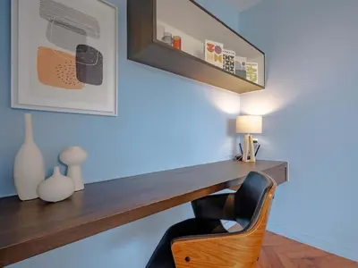 a room with a wooden desk and a chair at Blue Sky Penthouse @ Kamala Beach in Kamala Beach