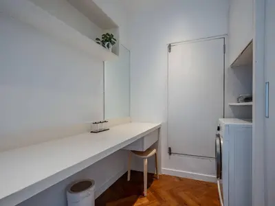 a white kitchen with a counter and a sink at Blue Sky Penthouse @ Kamala Beach in Kamala Beach