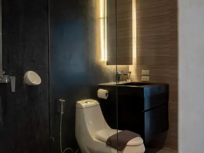 a bathroom with a toilet and a sink at Blue Sky Penthouse @ Kamala Beach in Kamala Beach