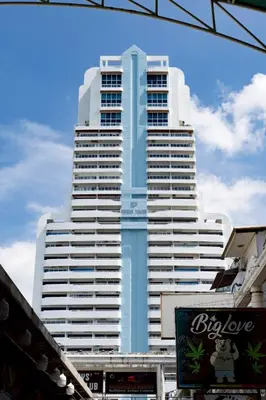 a tall blue and white skyscraper at 3Bedrooms Mountain View at Patong Tower Phuket in Patong Beach