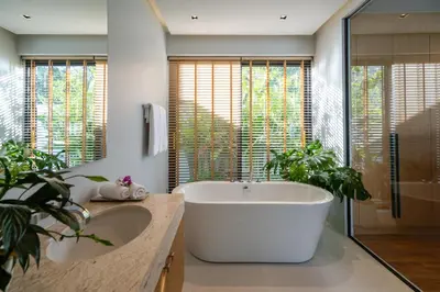 a bathroom with a large tub and two sinks at Villa Kaya, 3BR contemporary pool villa in Phuket