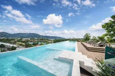 a swimming pool on top of a building at New 1BR Condo, walk to Bang Tao Beach in Laguna Phuket