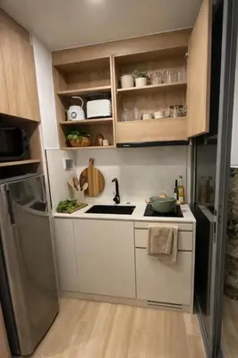 a small kitchen with a sink and a refrigerator at New 1BR Condo, walk to Bang Tao Beach in Laguna Phuket